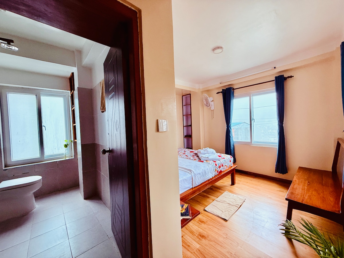 Perched on a mountain top, breathtaking city view.