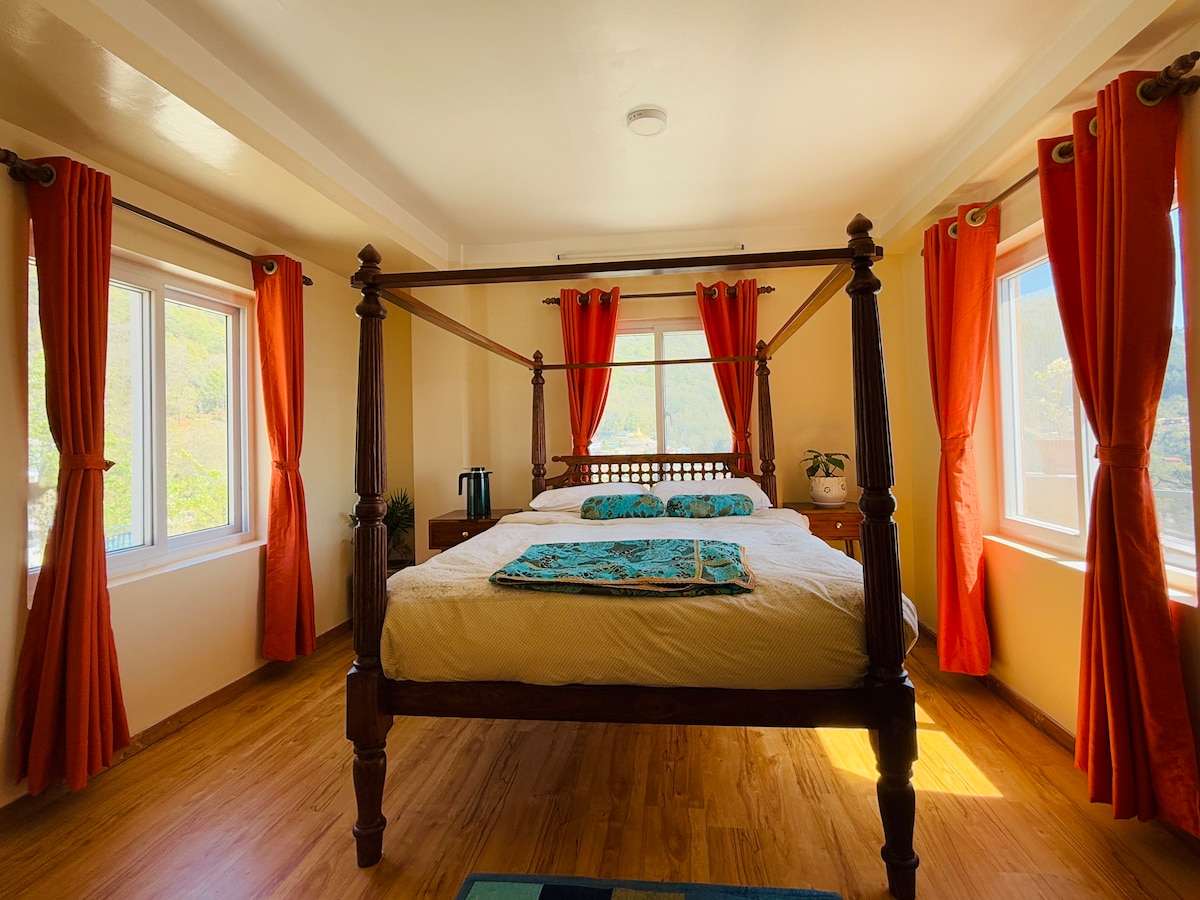 Perched on a mountain top, breathtaking city view.