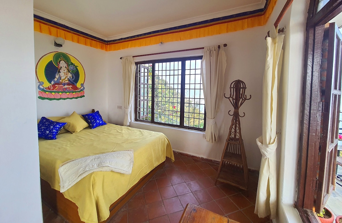 Peace Dragon Lodge. Double bed. Mountain views.