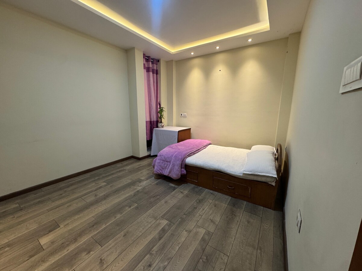 Peaceful room with private bathroom and balcony.